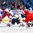 BUFFALO, NEW YORK - JANUARY 5: The Czech Republic's Martin Kaut #16 tries to gain control of the puck in front of USA's Jake Oettinger #30 and Andrew Peeke #20, as Filip Chytil #21 looks on during the bronze medal game of the 2018 IIHF World Junior Championship. (Photo by Andrea Cardin/HHOF-IIHF Images)

